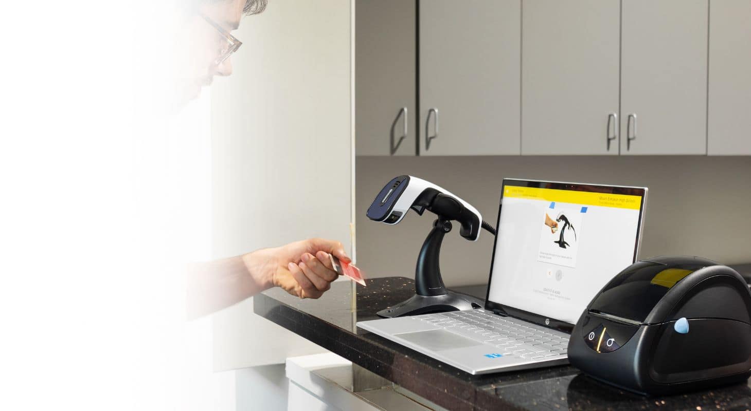 Teacher smiling at students in class 